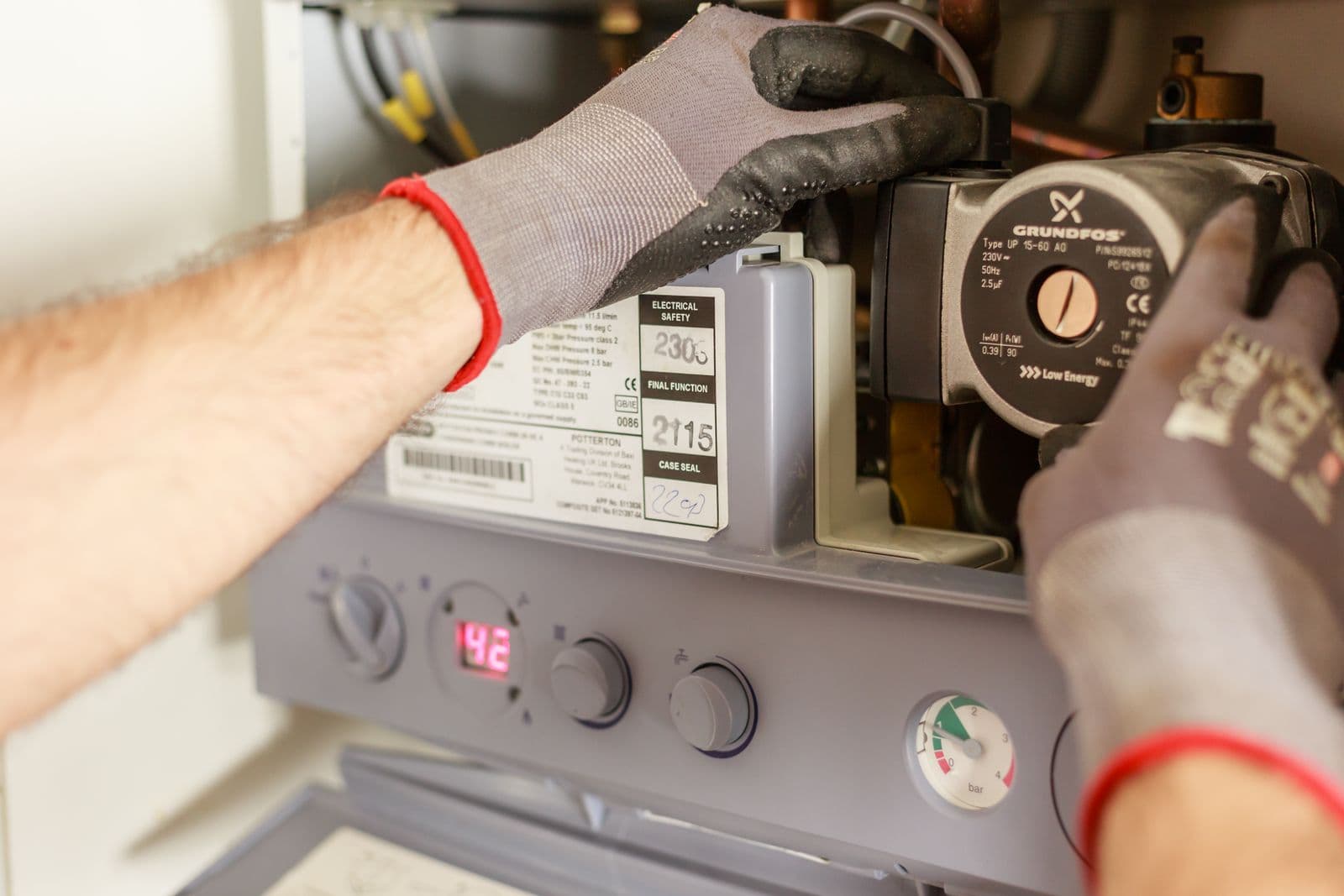 Engineer servicing a domestic gas boiler